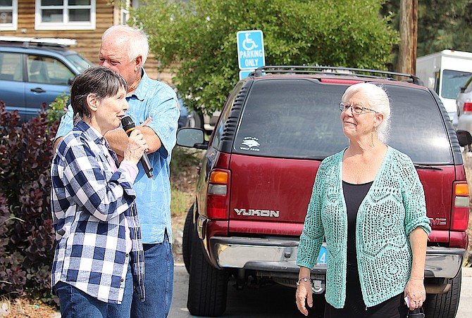 Historical Society member Karen Dustman talks about longtime archivist Nancy Thornburg on July 14 as Becky Thornburg listens. Richard Dustman is standing behind Karen.