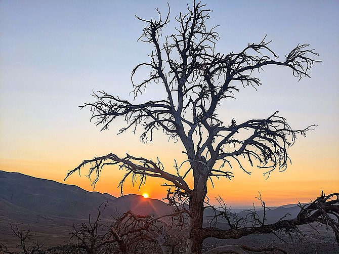 A tinge of orange in Wednesday morning's sunrise over Topaz Ranch Estates is likely to increase through today. John Flaherty photo special to The R-C