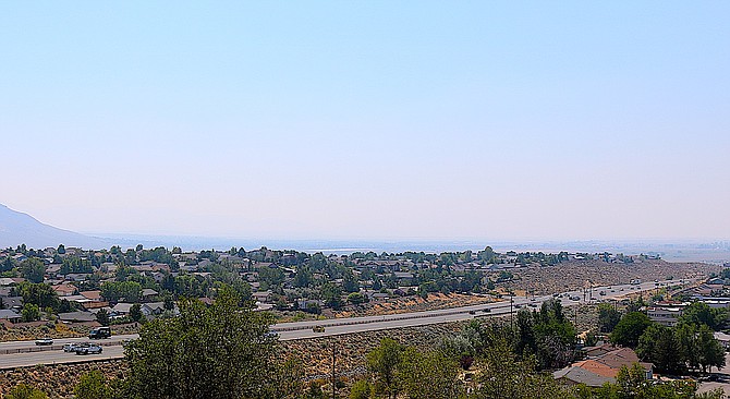 The Pine Nuts disappeared from view thanks to smoke from the top of Indian Hills on Wednesday.