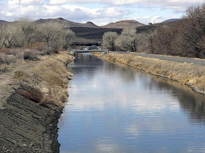 Water flows through an irrigation canal in Fernley on March 18, 2021.