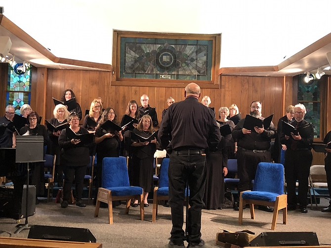 Director Gary Schwartz directing the Carson Chamber Singers in concert at First United Methodist Church last year.