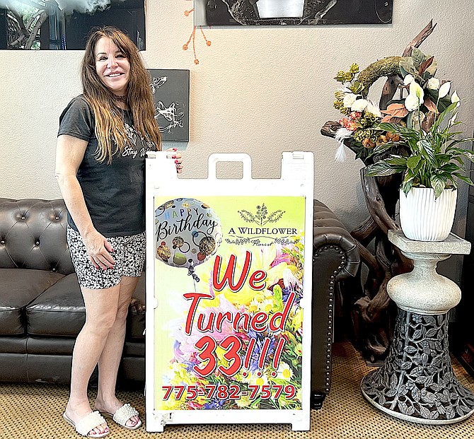 A Wildflower owner Lori Gabelman in her Gardnerville shop on Thursday.