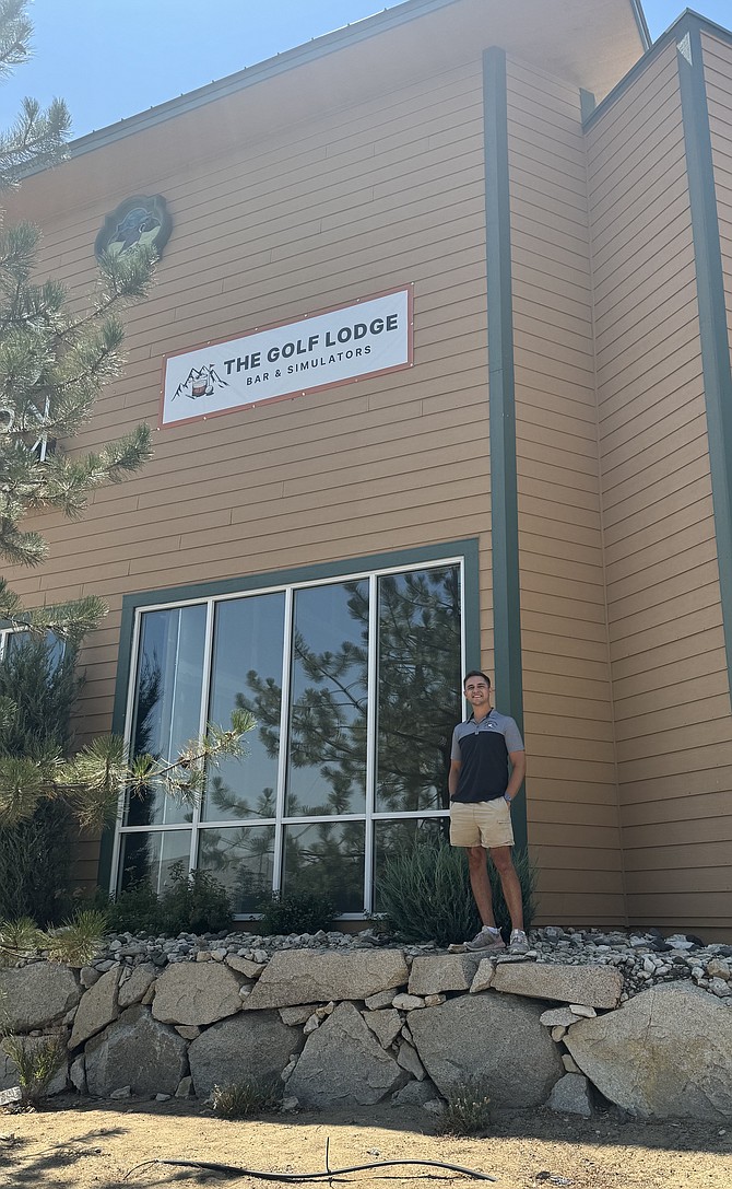 The Golf Lodge’s owner, Alec Emmons, stands in front of the latest indoor golf simulator to come to the Capital City. The indoor simulator will be open seven days a week, starting Aug. 23.