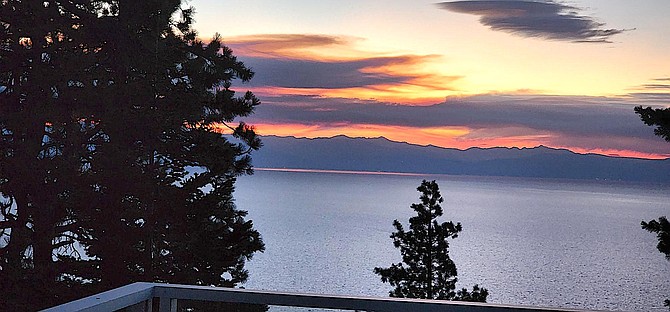 Cave Rock resident June Shafer sent in this photo of Wednesday's sunset over Lake Tahoe that might have some extra color thanks to a new fire burning near Placerville