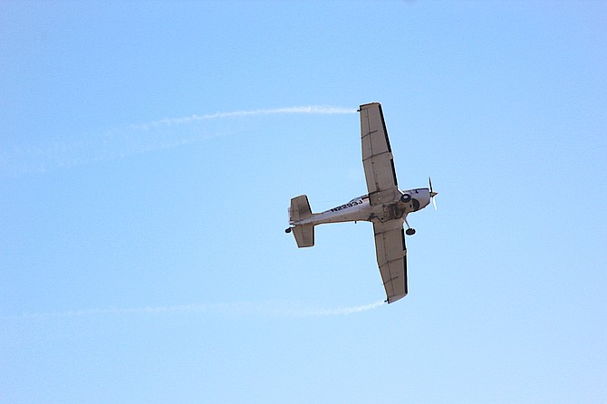 An aircraft sprays for mosquitoes over Carson Valley during summer 2023.