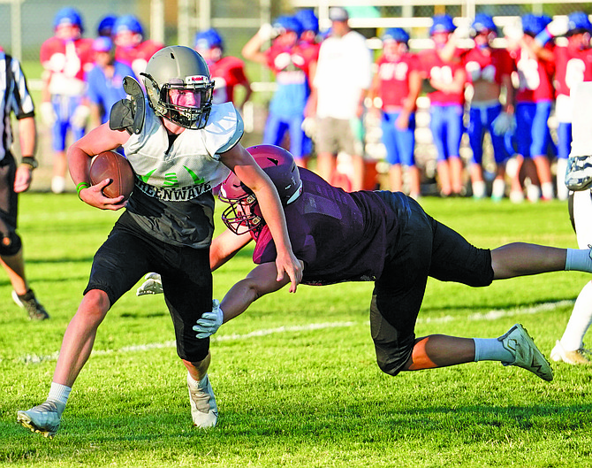 Fallon junior running back Carson Melendy tries to evade a Sparks defender during last week’s scrimmage.