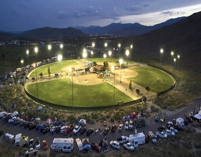 A photo of the upper softball fields in Centennial Park at night from Carson City.