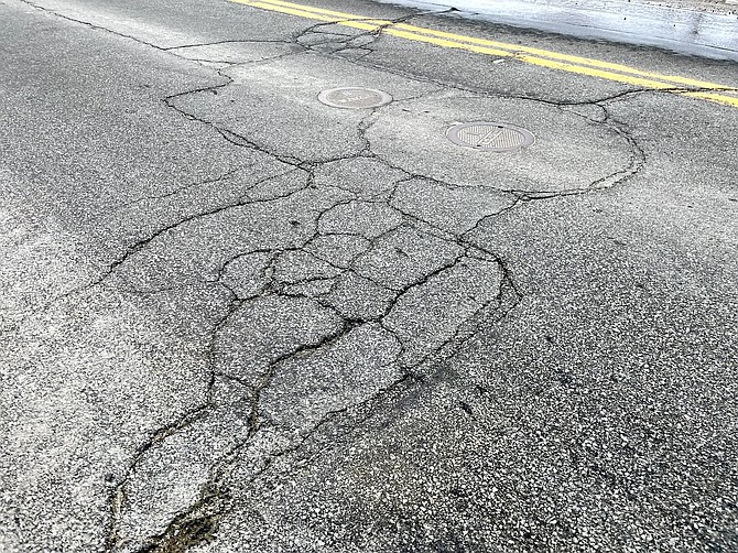 Damaged asphalt on South Curry Street in the winter of 2023. In 2022, the regional roads in Carson City had a pavement condition index of 74 (satisfactory), while local roads in 2022 had a PCI of 56 (fair approaching poor condition), according to Carson City Public Works.