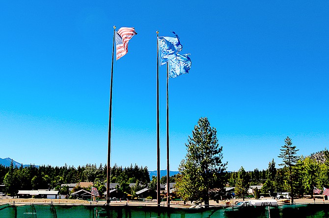 Flags fly in the breeze over what used to be the Lakeside Inn in Stateline.