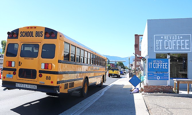 A school bus waits for traffic in Gardnerville on Thursday afternoon as construction on Highway 395 begins to wind down.