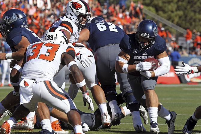 Nevada running back Toa Taua (35) runs for a touchdown against Oregon State during the teams’ 2018 game. The Wolf Pack and the Beavers will meet again at Mackay Stadium this season.