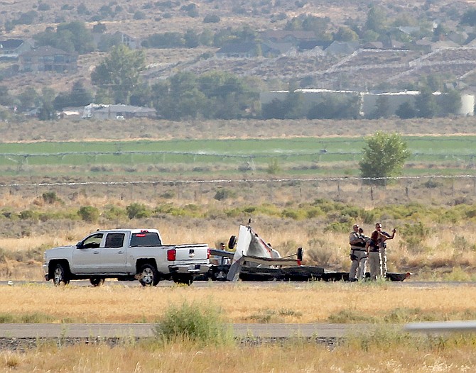 Rescuers at the site of an airplane crash at Minden-Tahoe Airport on Tuesday morning.