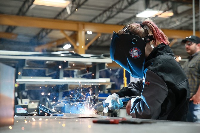 Student Bella Robertson practicing welding for the first time during the Heavy Metal Summer Experience in Las Vegas on July 11, 2024.