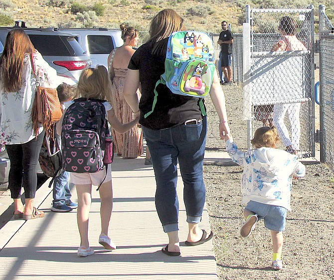 Students arrive for the first day of Jacks Valley Elementary School on Monday.