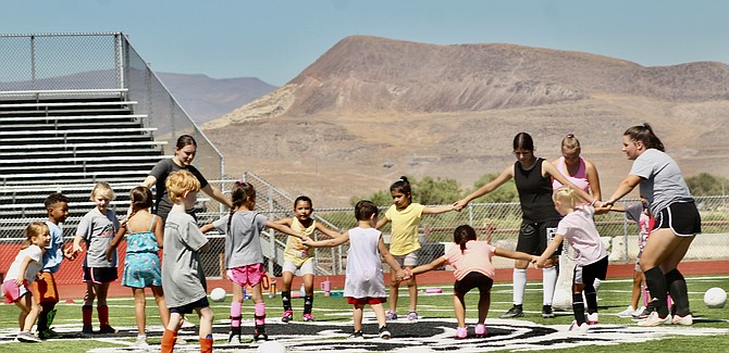 PCHS soccer players Kimi Trowbridge, Mili Gonzalez, Grace Kalsem and Lily Anderson-Burt help with the Pre-K-4th grade soccer camp on Aug. 16-17.