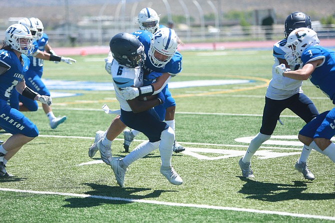 Justin Gonzalez makes a tackle on defense last Friday. Gonzalez and the Senators bested Spring Creek, 35-14, to start the season 2-0 Friday night. It marks the first 2-0 start to a season for Carson since 2012.