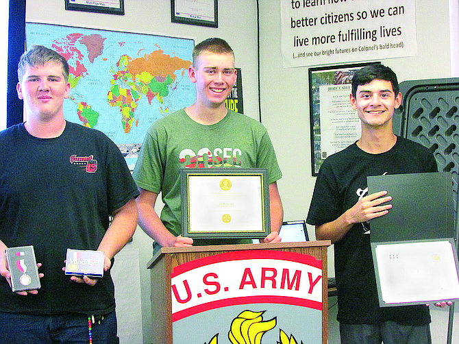 Douglas High School JRTOC Cadets and seniors Damian (Tigger) Russell, Ian McDonald, and Jacob Haire display their awards from the Leadership and Academic Bowl in Washington D.C., which they participated in during the summer. Senior and Cadet Aiden Martinez, not pictured, was also on the team.