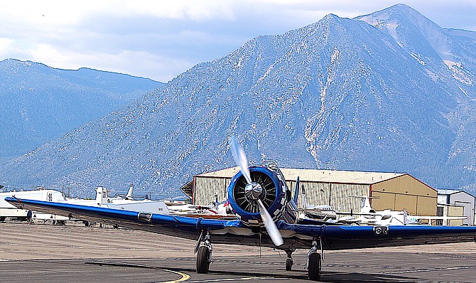 A T-6 Texan rolls down the runway at Minden-Tahoe Airport on Saturday morning.