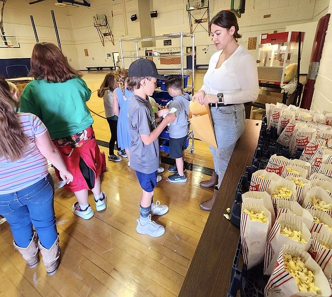 Students purchase items from the ECB Bulldog store and buy popcorn for "Popcorn Friday."