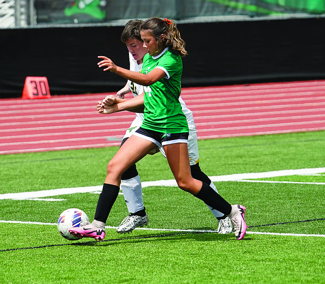 Fallon’s Jada Anastasio battles for possession against Battle Mountain on Saturday at the Edward Arciniega Athletic Complex.