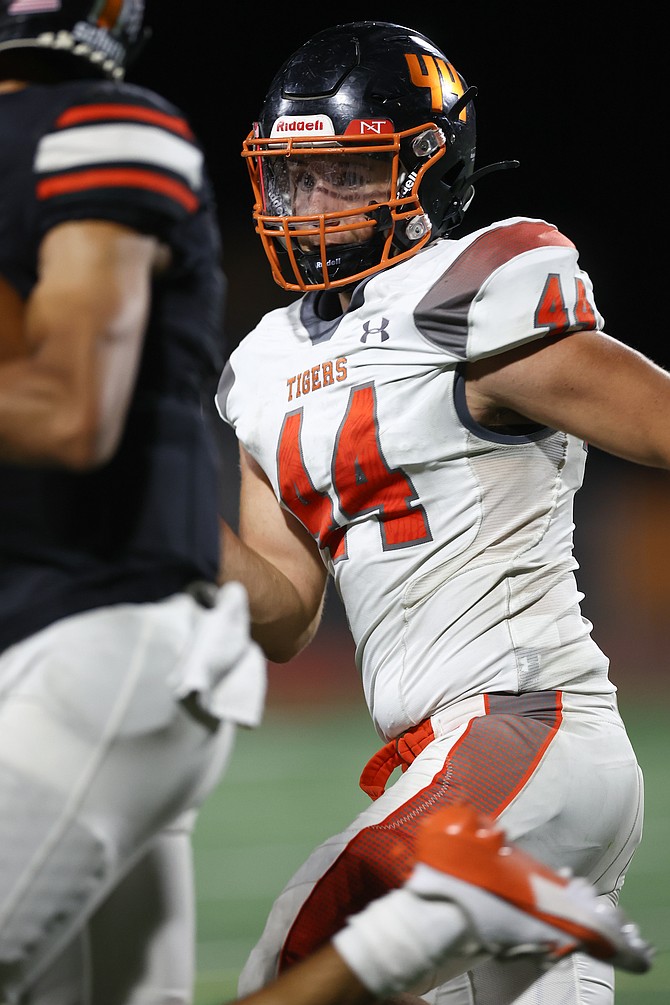 Douglas High’s Ayden Orr (44) tracks a Fernley ball carrier during the Tigers’ season-opening win. Orr and the Tigers host Spring Creek this Friday.