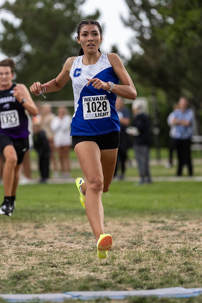 Carson High junior Brianna Rodriguez-Nunez crosses the finish line in first place at Lampe Park during the Douglas Class Races on Friday. Rodriguez-Nunez won the junior race in 15:07.