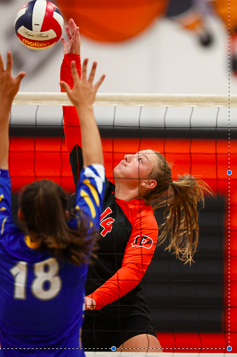 Douglas High junior Hailee Koontz (14) goes on the attack against Reed on Wednesday night. Koontz will be one of three mainstays in the middle of the floor for the Tigers this fall.