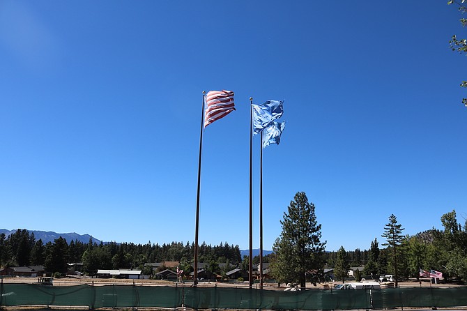 Flags over the site proposed for Barton's Stateline hospital.