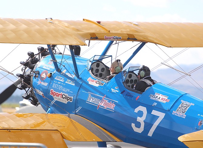 A veteran rides in a Stearman biplane operated by Legacy Airbase in Carson City. The Sports Aviation Foundation paid for the gas.