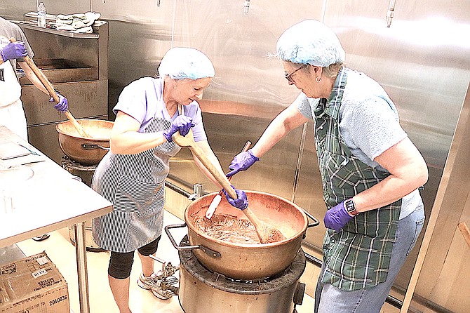 Beth Amheiser and Sherry Eriksen stir chocolate into Genoa's famous fudge on Wednesday morning. Last but certainly not least, the fudge is just one of eight different sorts of the roughly 3,000 pounds of candy being produced for Candy Dance, which is Sept. 28-29.