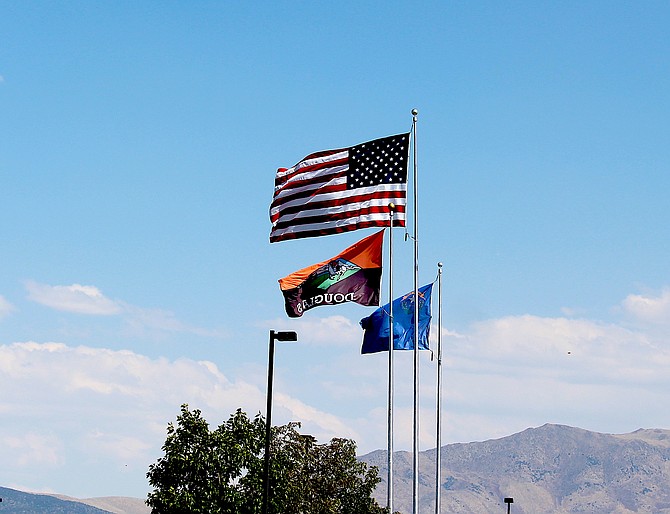 The breeze lofted the flags at the Douglas County Community and Senior Center on Sunday afternoon.