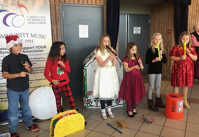 Symphony Youth Chorus with recorders in December 2023.