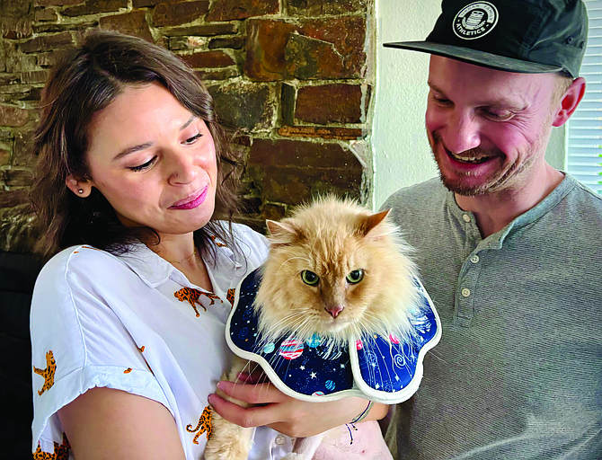 Monika Kennedy and David Alton with their cat Citra.