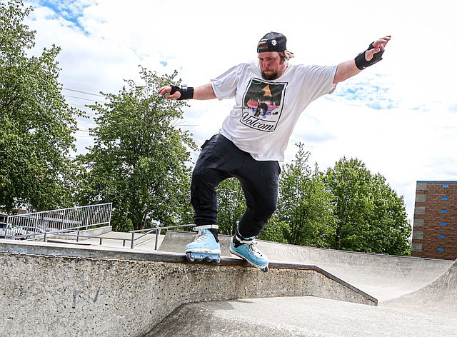 Shawn Jarvis works on his moves at the Snohomish Skate Park in late June. The Snohomish High Panther said ”I have been away for about 10 years and was afraid I had forgotten how.” Jarvis’s fiancée was sitting in the shade reading. They are from Edmonds and drive to different skate parks in the area.