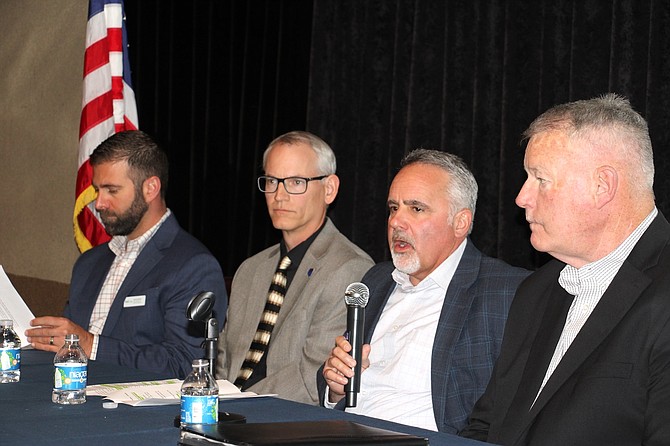 From left, Dennis Bartlett, vice president of utility development with Tract, Storey County Manager Austin Osborne, Jeff Brigger, director of business development and major accounts with NV Energy, and Rick Nelson, senior vice president with Mark IV Capital.