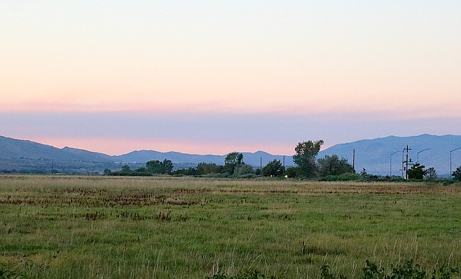 A purple cloud stretched across the horizon north of Carson Valley on Tuesday evening. Smoke from the Bear Fire could arrive on the wind later today.