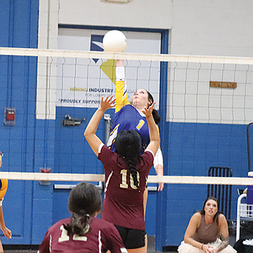 Lowry’s Karyn Morton finishes off a kill in the Lady Bucks’ four-set win over Sparks on Thursday night in Winnemucca,