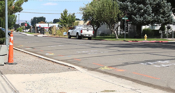 Put the sidewalk on the dotted line. 10th Street was tagged by contractors on Friday in preparation for work to install a sidewalk on its west side starting this morning.