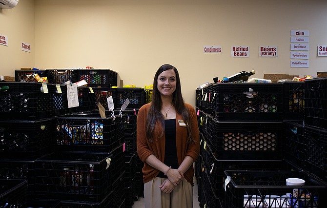 Megan Kemmett stands inside the food-storage room in the Snohomish Community Food Bank on Sept. 4.