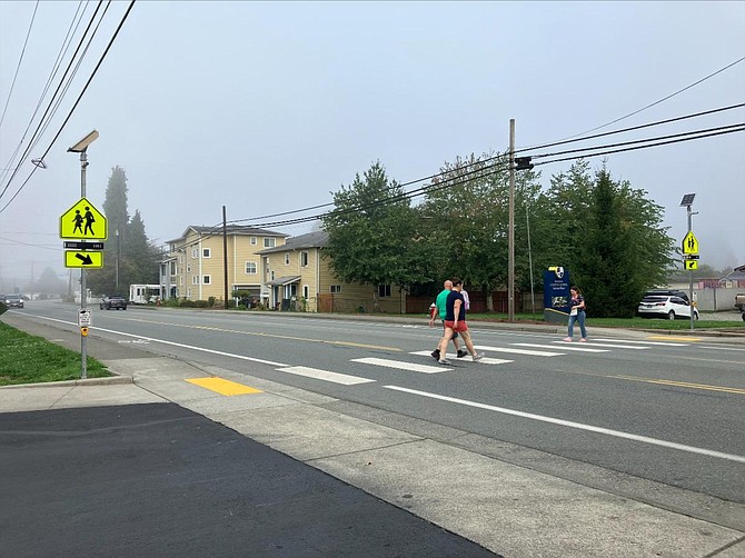 The new flashing crosswalk signs at one of the pedestrian crossings along W. Main Street between New Hope Fellowship and Monroe Christian.