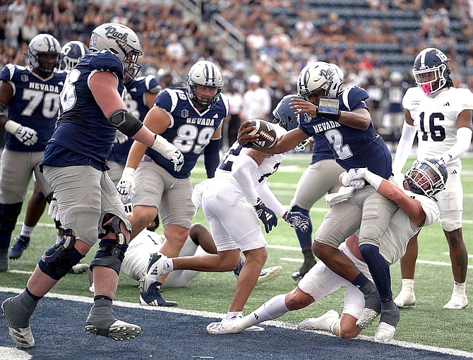 Nevada quarterback Brendon Lewis crosses the goal line in the first quarter of the Wolf Pack's loss against Georgia Southern on Saturday at Mackay Stadium.