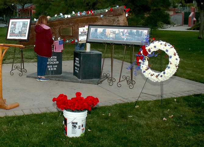 People attending the 2024 Sept. 11 ceremony in Carson City placed flowers on a steel beam, which was part of the World Trade Center.