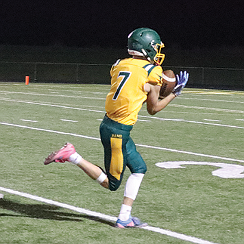 Battle Mountain’s Jake Perrone stiff arms a Silver Stage defender during Friday’s home win.