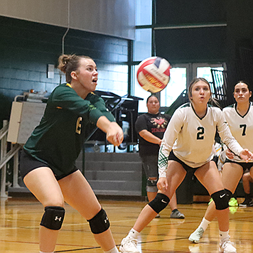 Battle Mountain's Lindsey Bleak passes the ball to a teammate after receiving a Oasis Academy serve on Friday in Battle Mountain.