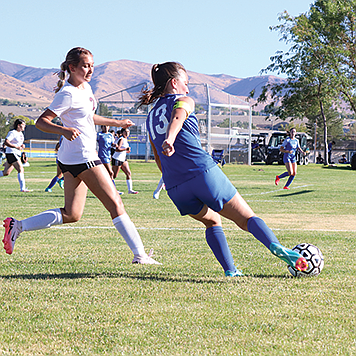 Lowry's Damiena Mentaberry puts a shot on goal against West Wendover on Aug. 30