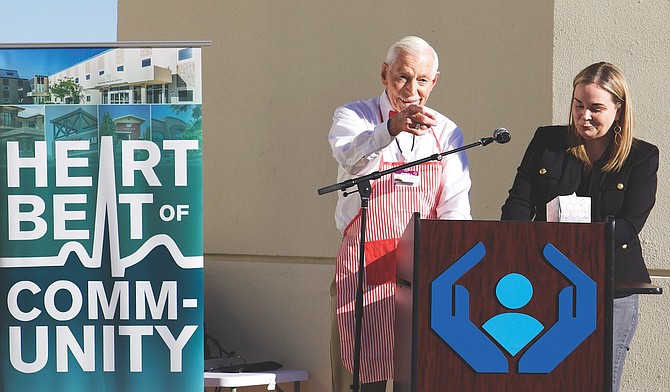 Carson City’s George Allison acknowledges the crowd as Paula Mayer, development officer, Community and Foundation for Carson Tahoe, honors Allison with a lifetime achievement award for his commitment to the hospital during Carson Tahoe Health’s 75th anniversary celebration Sept. 12, 2024.