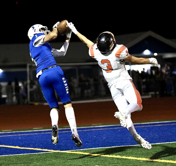 Carson's Zack Eaton hauls in the Senators' first touchdown of the game Friday night in a loss to Douglas, 47-13.