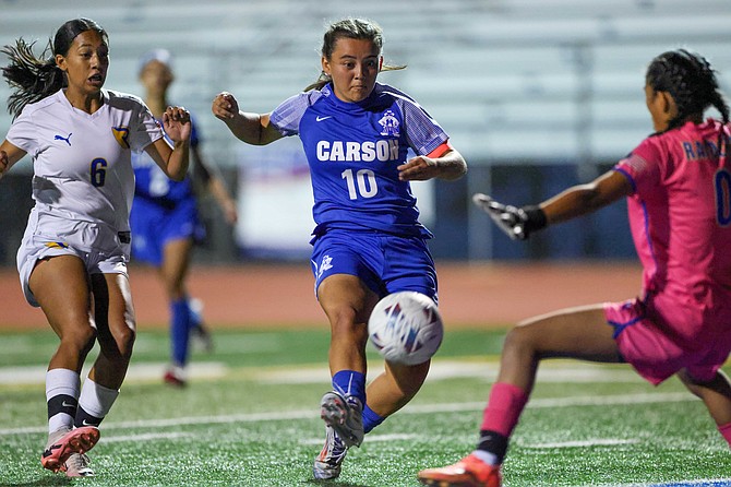 Carson High’s Alondra Carillo breaks in on net against Reed on Tuesday. Carillo tallied the Senators’ lone goal in a 1-1 draw.