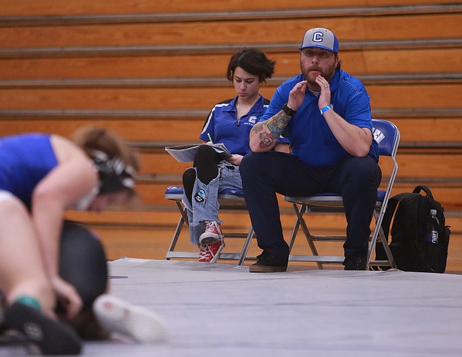 Carson High School head wrestling coach Nick Redwine looks on during a girls wrestling match. Redwine is hoping the program can find a dedicated girls wrestling coach, heading into the 2024-25 season.