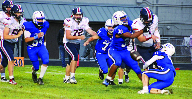 Eatonville's Isaiah Whatley (#30) and Cole Bamford (#41) wrap up Black Hills quarterback Jaxsen Beck on the Cruisers 28-0 shutout of the Wolves this past Thursday night.